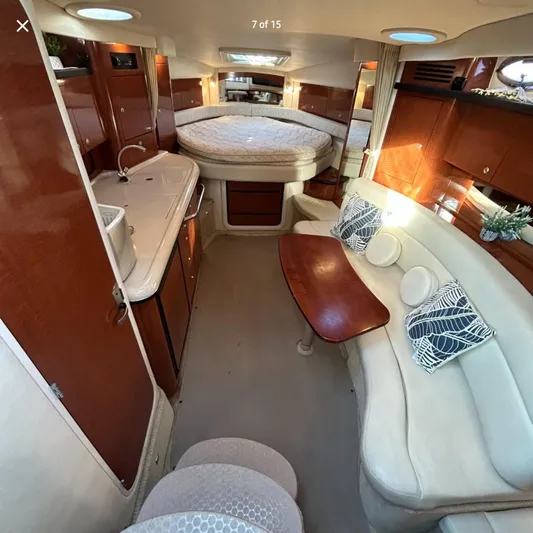  Yacht Photos Pics Interior of 2005 Sea Ray 340 Sundancer yacht with cozy seating and elegant wood finishes.
