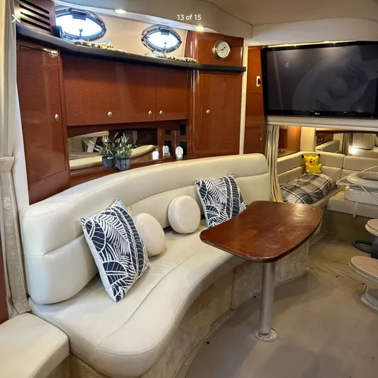  Yacht Photos Pics Luxurious interior of 2005 Sea Ray 340 Sundancer with plush seating and elegant wood finishes.
