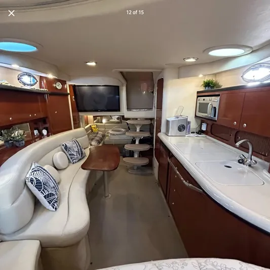  Yacht Photos Pics Luxurious interior of 2005 Sea Ray 340 Sundancer yacht with modern amenities and elegant design.