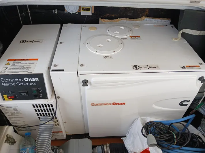 Patange II Yacht Photos Pics Cummins Onan marine generator in a 2009 Lagoon 440 yacht engine compartment.