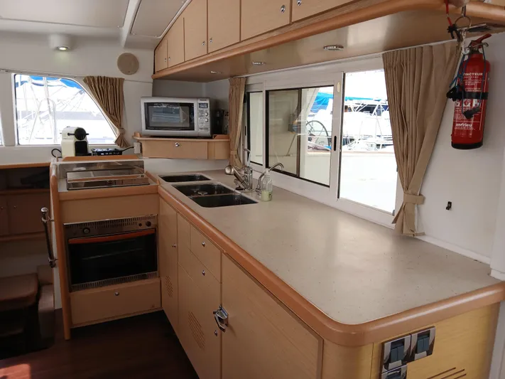 Patange II Yacht Photos Pics Interior of 2009 Lagoon 440 yacht kitchen with modern appliances and ample counter space.