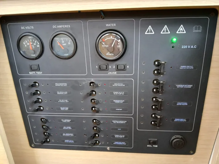 Patange II Yacht Photos Pics Control panel of a 2009 Lagoon 440 yacht, featuring gauges and switches.