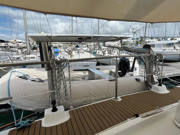 Patange II Yacht Photos Pics 2009 Lagoon 440 catamaran docked, featuring a spacious deck and inflatable dinghy.