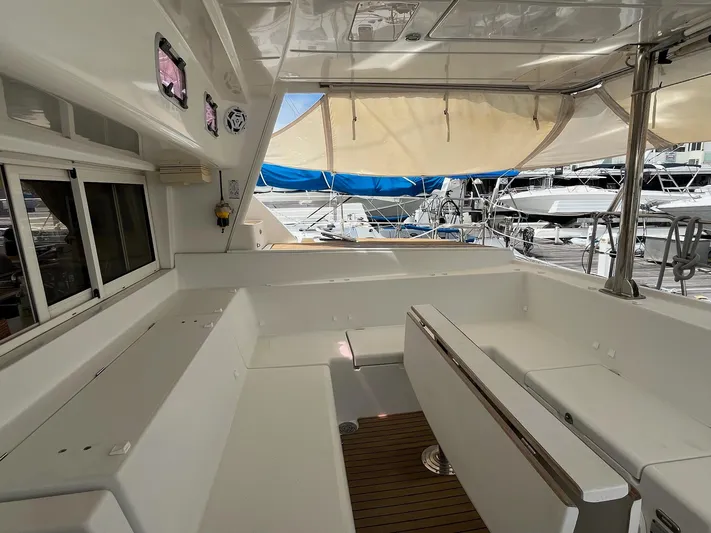 Patange II Yacht Photos Pics 2009 Lagoon 440 yacht interior with white seating and marina view.