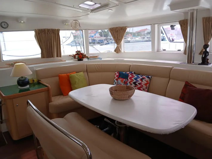 Patange II Yacht Photos Pics Luxurious interior of 2009 Lagoon 440 catamaran with cozy seating and colorful cushions.