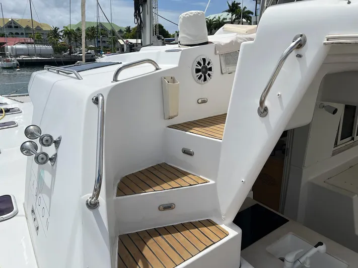 Patange II Yacht Photos Pics Staircase on 2009 Lagoon 440 yacht with teak steps and stainless steel handrails.