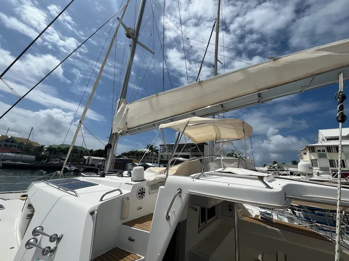Patange II Yacht Photos Pics 2009 Lagoon 440 catamaran docked under a partly cloudy sky.