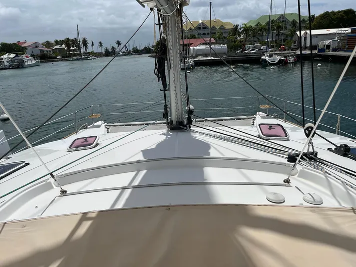 Patange II Yacht Photos Pics 2009 Lagoon 440 catamaran docked in a marina, view from the deck.