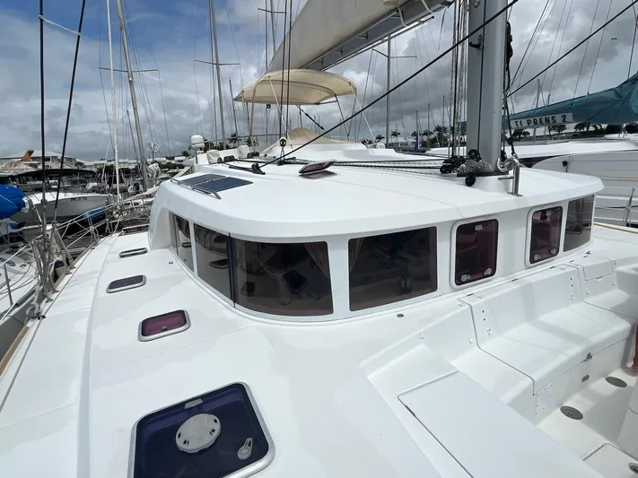 Patange II Yacht Photos Pics 2009 Lagoon 440 catamaran docked at marina, featuring sleek white design and spacious deck.