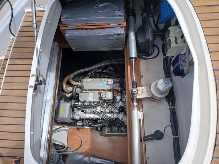 Patange II Yacht Photos Pics Engine compartment of a 2009 Lagoon 440 catamaran, showcasing mechanical components and layout.