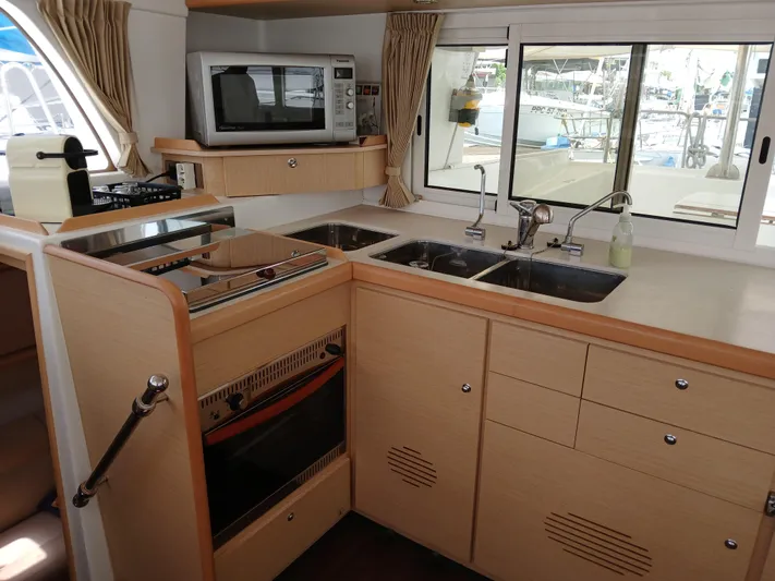 Patange II Yacht Photos Pics Interior kitchen of 2009 Lagoon 440 yacht with modern appliances and ample counter space.