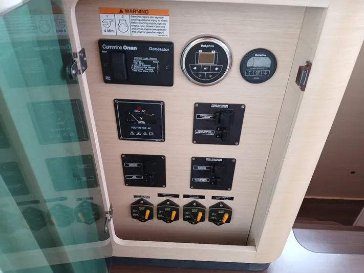 Patange II Yacht Photos Pics Control panel of a 2009 Lagoon 440 yacht, featuring generator and electrical switches.