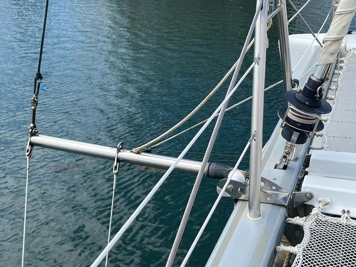 Patange II Yacht Photos Pics 2009 Lagoon 440 catamaran deck with rigging over calm water.