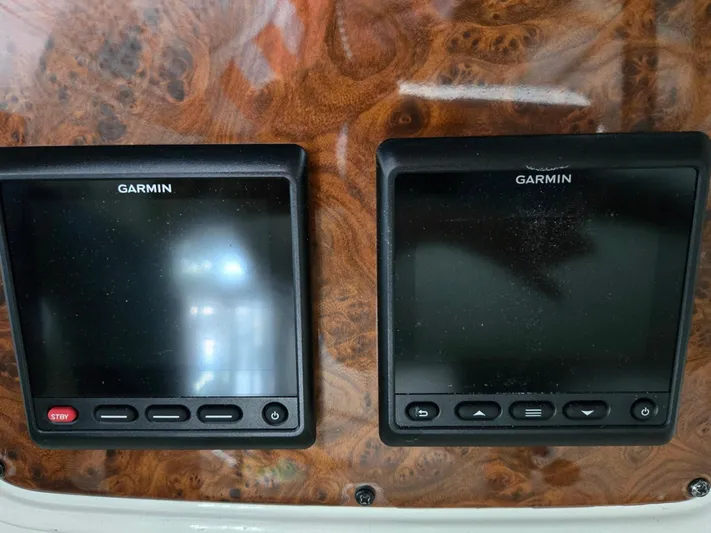 Mad Mary Yacht Photos Pics Garmin navigation screens on a 2004 Meridian 381 Sedan dashboard.