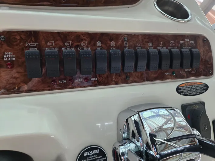 Mad Mary Yacht Photos Pics Control panel of a 2004 Meridian 381 Sedan boat with various switches and labels.