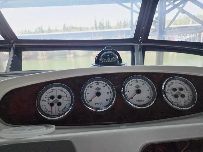 Mad Mary Yacht Photos Pics Dashboard of a 2004 Meridian 381 Sedan boat with gauges and compass.