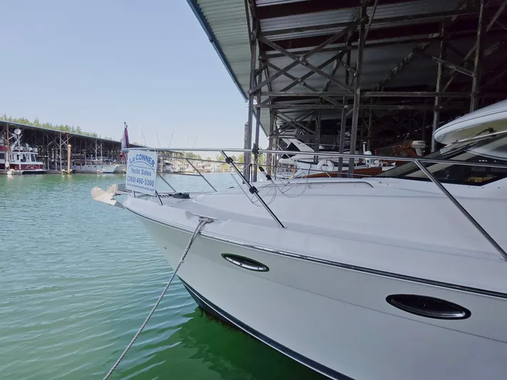 Mad Mary Yacht Photos Pics 2004 Meridian 381 Sedan yacht docked in marina, partially covered, with calm water.