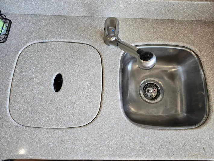 Mad Mary Yacht Photos Pics Stainless steel sink and faucet on a Meridian 381 Sedan 2004 yacht.