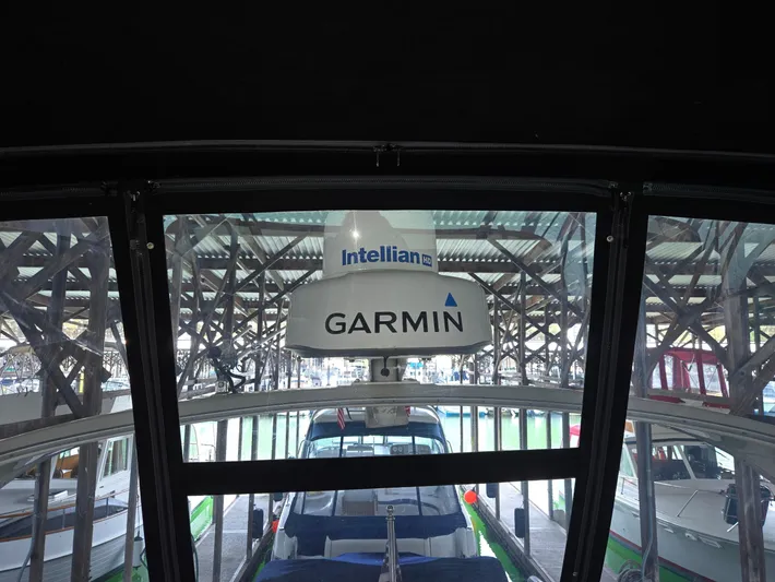 Mad Mary Yacht Photos Pics 2004 Meridian 381 Sedan with Garmin and Intellian equipment in a marina setting.