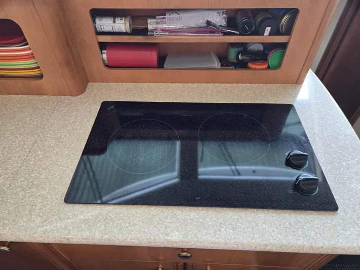 Mad Mary Yacht Photos Pics Glass cooktop on a Meridian 381 Sedan 2004 yacht kitchen counter.