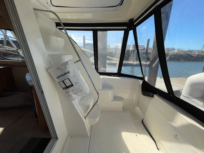 Mad Mary Yacht Photos Pics Interior view of 2004 Meridian 381 Sedan boat with large windows and seating area.