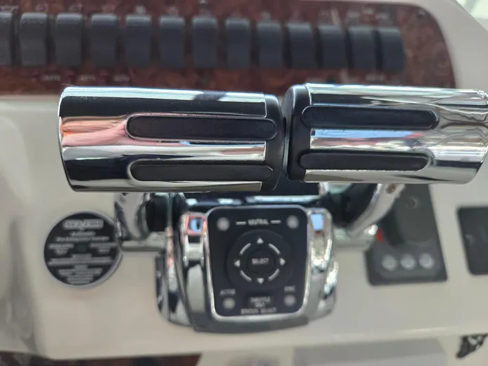 Mad Mary Yacht Photos Pics Control panel of a 2004 Meridian 381 Sedan boat with chrome throttle levers.