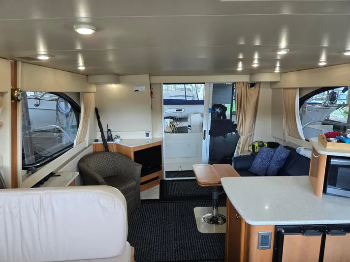 Mad Mary Yacht Photos Pics Interior of 2004 Meridian 381 Sedan yacht, featuring modern seating and elegant design.
