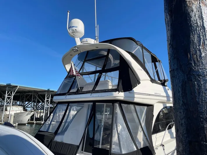 Mad Mary Yacht Photos Pics 2004 Meridian 381 Sedan yacht docked under clear blue sky.