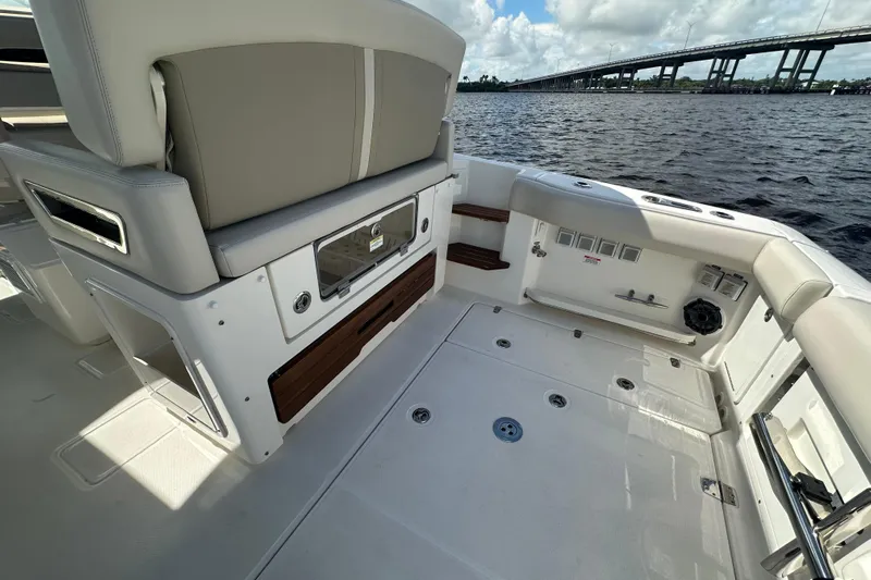  Yacht Photos Pics 2023 Boston Whaler 380 Realm boat interior with seating and water view.