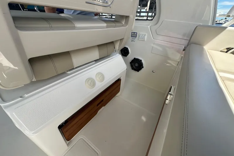  Yacht Photos Pics Interior view of 2023 Boston Whaler 380 Realm boat, featuring seating and storage compartments.