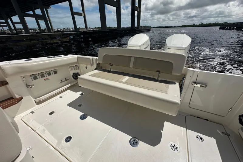  Yacht Photos Pics 2023 Boston Whaler 380 Realm boat deck with seating and twin engines.