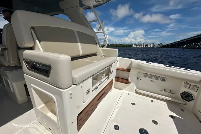  Yacht Photos Pics 2023 Boston Whaler 380 Realm interior with seating, overlooking water and bridge.