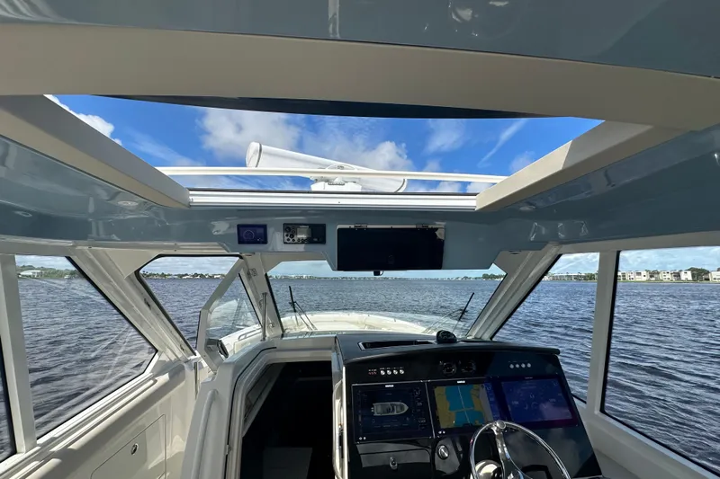  Yacht Photos Pics Interior view of 2023 Boston Whaler 380 Realm boat, featuring advanced navigation systems.