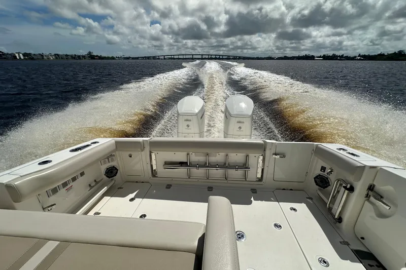  Yacht Photos Pics 2023 Boston Whaler 380 Realm cruising on open water, showcasing powerful dual engines.