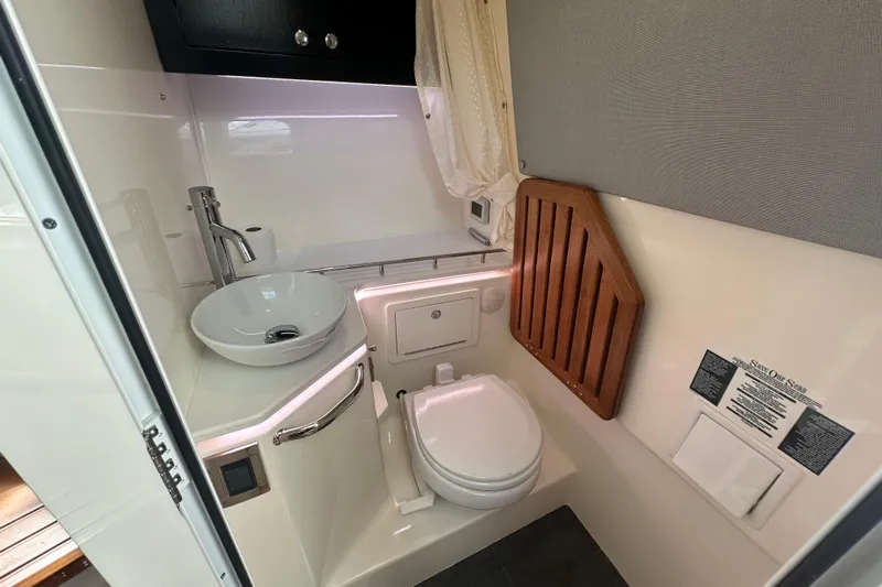  Yacht Photos Pics 2023 Boston Whaler 380 Realm bathroom with modern sink and toilet.
