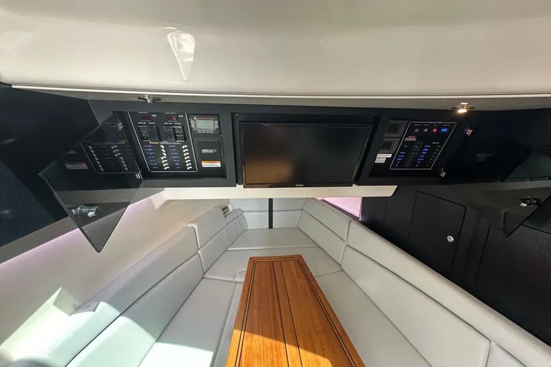  Yacht Photos Pics 2023 Boston Whaler 380 Realm interior with control panels and seating area.