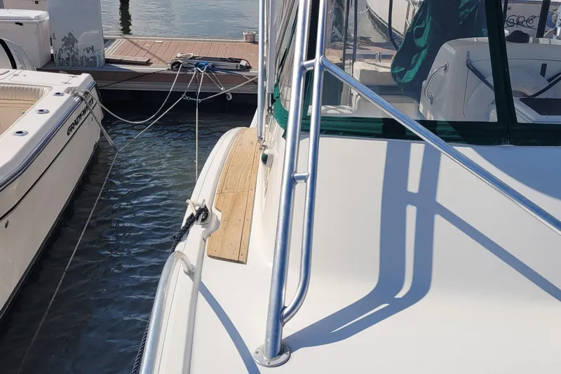 Wave Dancer Yacht Photos Pics 2002 SeaTek 36 Express yacht docked beside another boat at a marina.