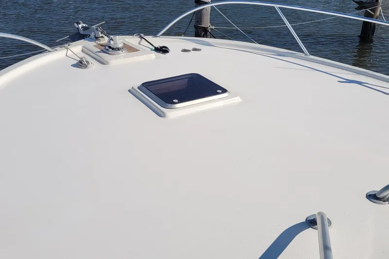 Wave Dancer Yacht Photos Pics Bow view of 2002 SeaTek 36 Express boat with hatch and railing.