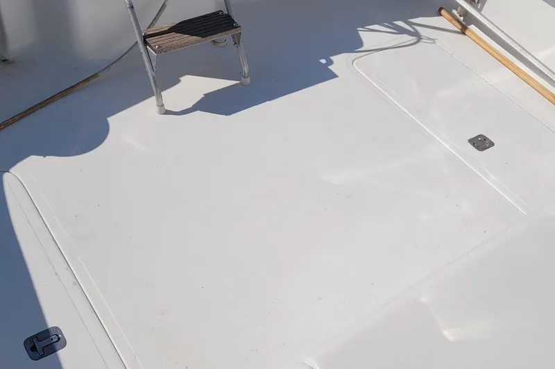 Wave Dancer Yacht Photos Pics Deck of 2002 SeaTek 36 Express boat with ladder and clean surface.