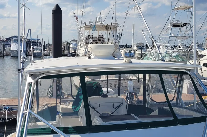Wave Dancer Yacht Photos Pics 2002 SeaTek 36 Express boat docked at a marina, surrounded by other vessels.