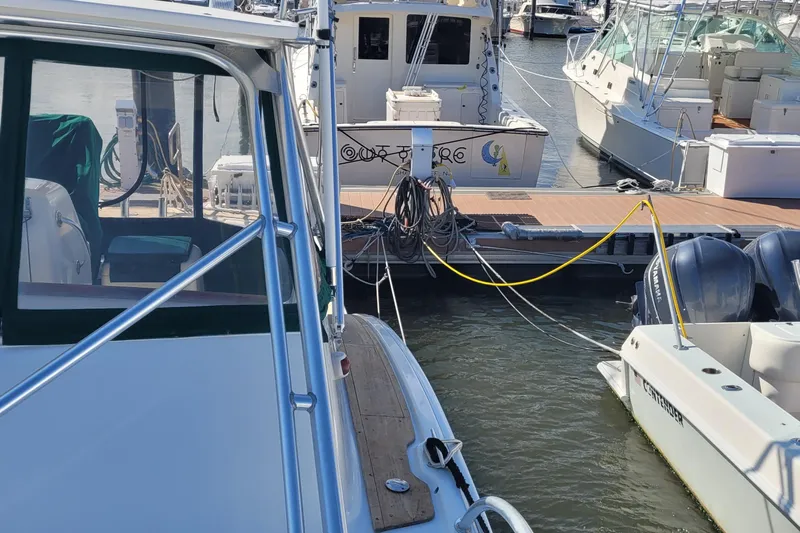 Wave Dancer Yacht Photos Pics 2002 SeaTek 36 Express docked at marina with other boats.