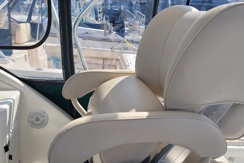Wave Dancer Yacht Photos Pics Luxurious seating on 2002 SeaTek 36 Express boat, featuring elegant white upholstery.