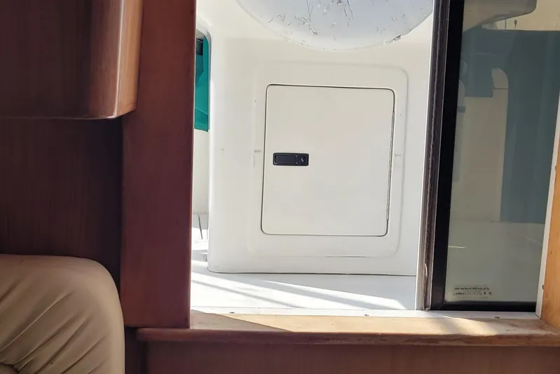 Wave Dancer Yacht Photos Pics Interior view of a 2002 SeaTek 36 Express boat, featuring a cabin window and door.