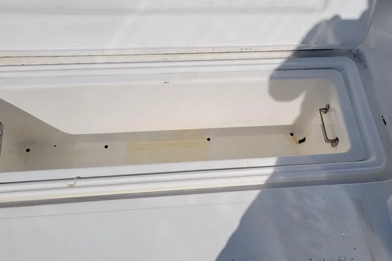 Wave Dancer Yacht Photos Pics Open storage compartment on 2002 SeaTek 36 Express boat, showing interior details.