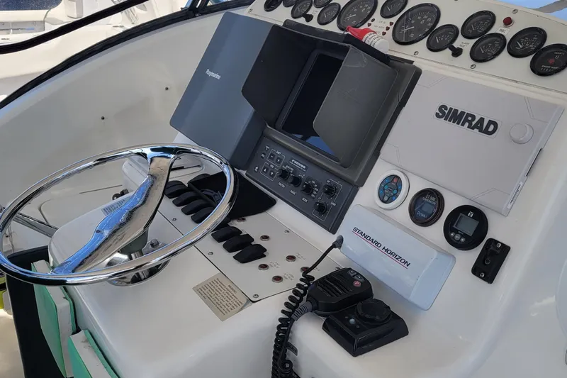 Wave Dancer Yacht Photos Pics Control panel of a 2002 SeaTek 36 Express boat with navigation equipment.
