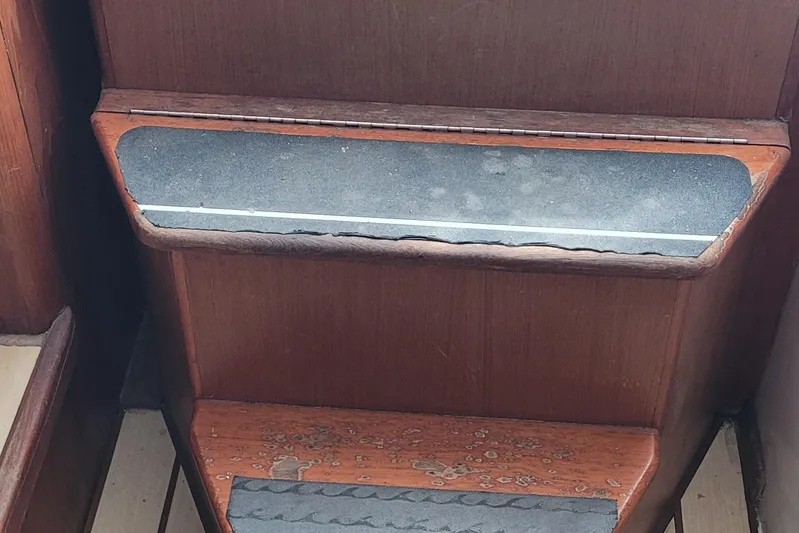 Wave Dancer Yacht Photos Pics Wooden steps with anti-slip strips on a 2002 SeaTek 36 Express boat.