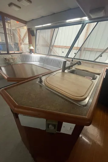  Yacht Photos Pics Interior of 1988 Bayliner 4588 yacht with kitchen sink and seating area.