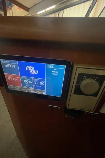  Yacht Photos Pics Control panel of a 1988 Bayliner 4588 displaying power and battery status.