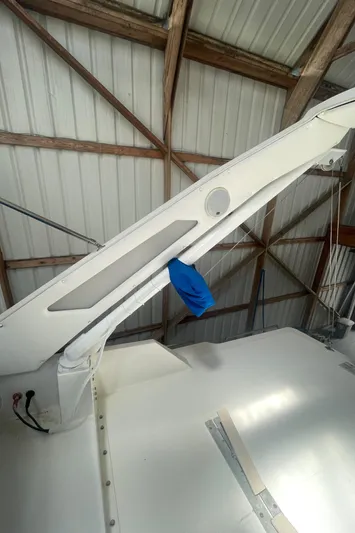  Yacht Photos Pics 1988 Bayliner 4588 yacht detail in a boathouse, showcasing structural elements and a blue cover.