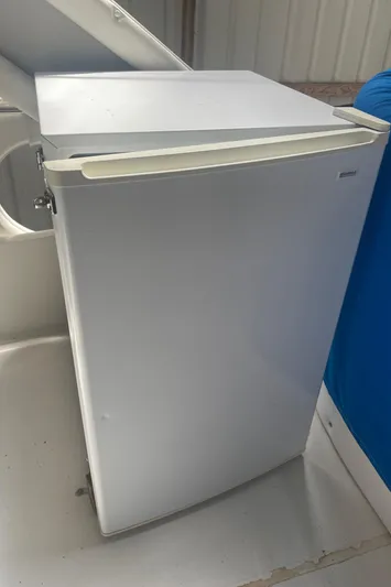  Yacht Photos Pics White mini fridge on 1988 Bayliner 4588 boat deck.
